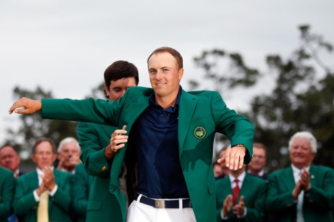 Jordan Spieth dones the green jacket after winning the 2015 Masters Tournament at Augusta National Golf Club. Photo: AFP