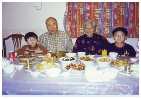 Grandfather Wong Ping-hang (2nd from left) and Lau Kit-sheung with their grandchildren James (left) and Allen (right). Photo: SCMP Pictures