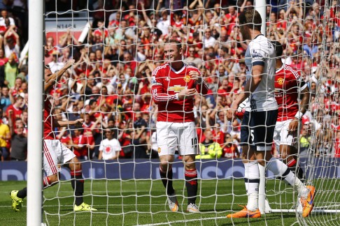 Wayne Rooney celebrates after Tottenham's Kyle Walker scores an own goal - the first goal for Manchester United. 