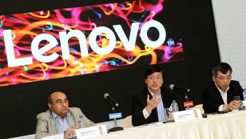 Lenovo president Gianfranco Lanci, left, attends Lenovo's annual results press conference in Hong Kong earlier this year. The company plans to axe over 3,000 jobs following disappointing results for the latest quarter. Photo: Franke Tsang