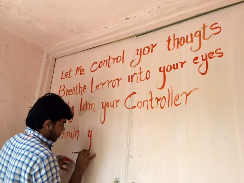 A student paints graffiti on a campus wall at the Film and Television Institute of India. Photo: TNS 