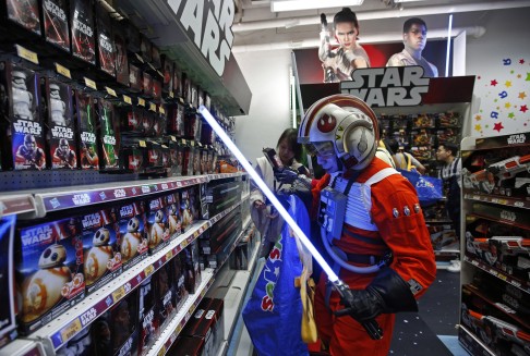 Star Wars fans shop at a toy store at the midnight in Hong Kong. Photo: AP