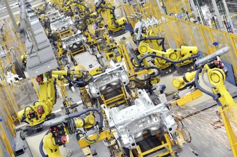 Robot arms weld car parts at an auto plant of Dongfeng Peugeot Citroen Automobile Co., Ltd. in Wuhan city, central China's Hubei province. Photo: Imaginechina