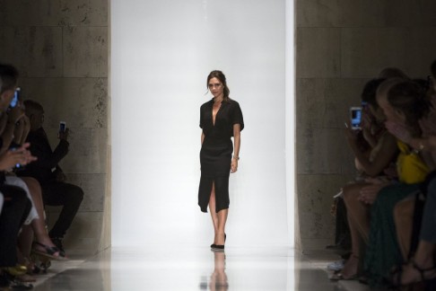 Beckham appears at the end of the show in one of her trademark black dresses.