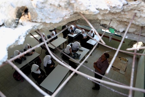 Students in a war-damaged school in Gaza. Photo: AFP
