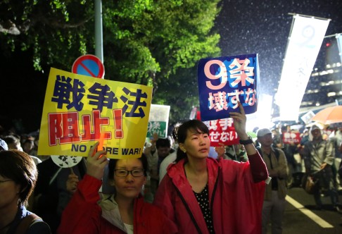 People attend a rally against the controversial security bills in front of the National Diet Building in Tokyo. Photo: Xinhua