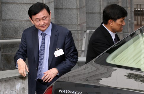 Former Thai Prime Minister Thaksin Shinawatra (L) in Hong Kong in 2012.  Thaksin, who lives abroad to avoid a jail sentence for graft, was ousted in a coup in 2006, but remains a major figure in Thai politics. Photo: Felix Wong
