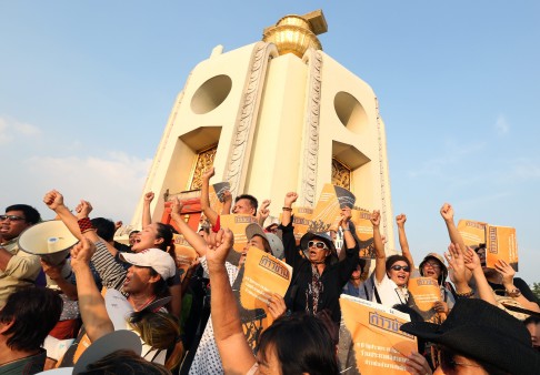 Thai anti-coup activists gather at the Democracy Monument in Bangkok on Saturday to mark nine years since the 2006 military coup against then-premier Thaksin Shinawatra. Photo: EPA 