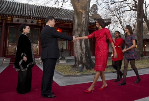 President Xi Jinping and his wife first lady Peng Liyuan (left) greet US first lady Michelle Obama and her daughters Malia (second right) and Sasha in Beijing in May last year. Photo: Reuters