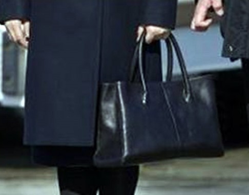 Peng Liyuan helped to make the Chinese fashion brand Exception de Mixmind a household name during the Moscow trip when she was photographed sporting one of its black coats and bags. Photo: SCMP Pictures
