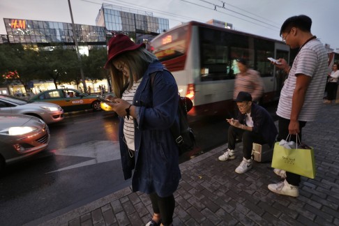 More commuters are relying on car-hailing apps during busy periods in cities like Beijing. Photo: EPA