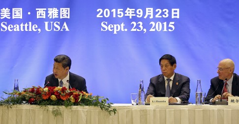 Chinese President Xi Jinping, Li Zhanshu and former U.S. Treasury Secretary Henry Paulson. Photo: AP