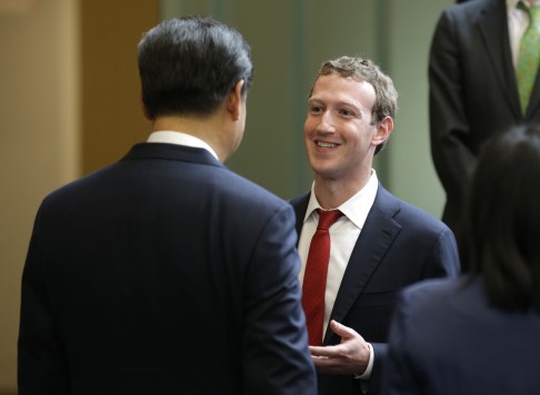 Chinese President Xi Jinping talks with Facebook chief executive Mark Zuckerberg during a gathering of CEOs and other executives at Microsoft's main campus in Redmond, Washington on Wednesday. Photo: AFP