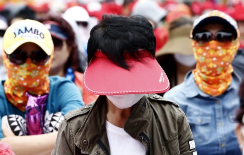 South Korean sex workers join a rally this month in Seoul urging the government to repeal the country's anti-prostitution laws. Photo: EPA