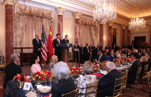 Xi (second left) attends a luncheon hosted by US Vice President Joe Biden (left) and Secretary of State John Kerry (right) at the State Department in Washington D.C. on Friday. Photo: Xinhua