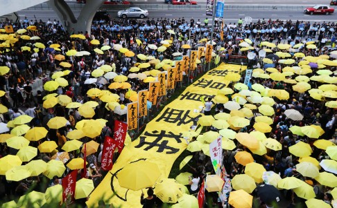 Many people carrying yellow umbrellas, gathered in Admiralty to mark one year since police fired tear gas at protesters. Photo: Felix Wong