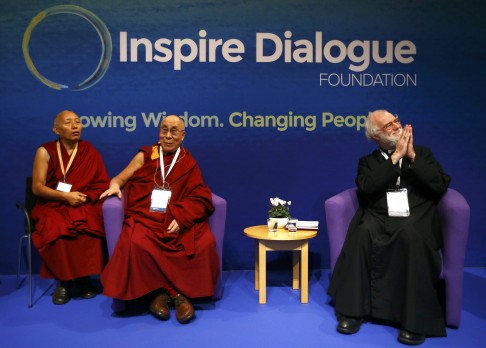 The Dalai Lama waits before speaking with the former Bishop of Canterbury Lord Williams at Magdalene College in Cambridge, Britain on September 16. Photo: Reuters