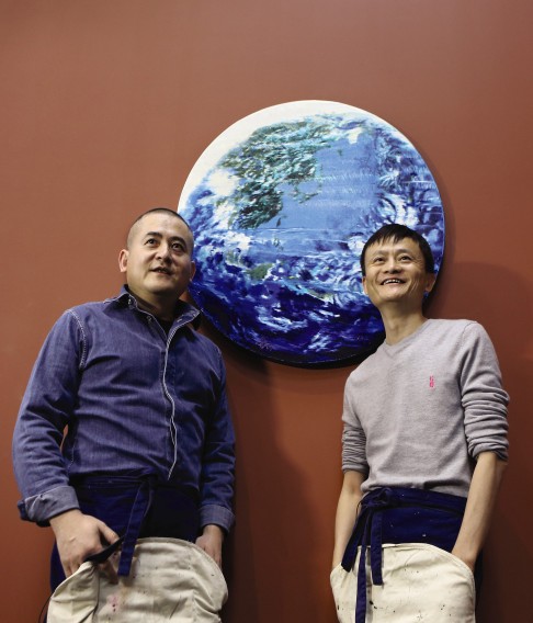 Zeng Fanzhi (left) and Jack Ma pose with "Paradise", which they painted to raise money for a conservation charity. Photo: Sotheby's