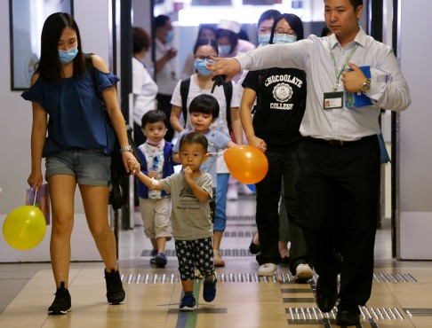 Families from a public housing estate in Hong Kong await the results of tests for lead levels in their blood following a scare over contamination of water supplies. 