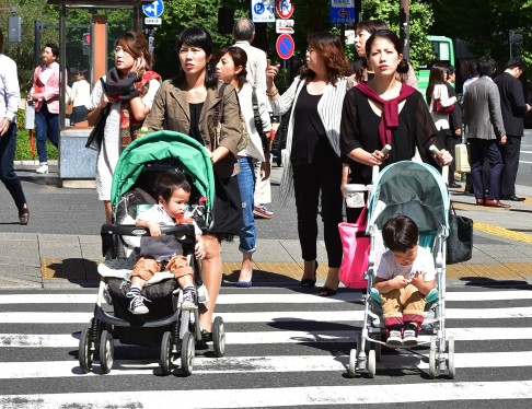 Japan has large numbers of highly educated and skilled women outside the workforce. Despite 86 per cent of married Japanese mothers stating they wish to stay in work, around half quit a year after giving birth. Photo: AFP