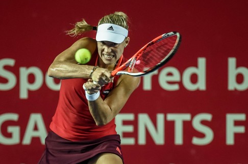 Angelique Kerber of Germany returns the ball to Kurumi Nara of Japan in their second round match. Photo: AFP 
