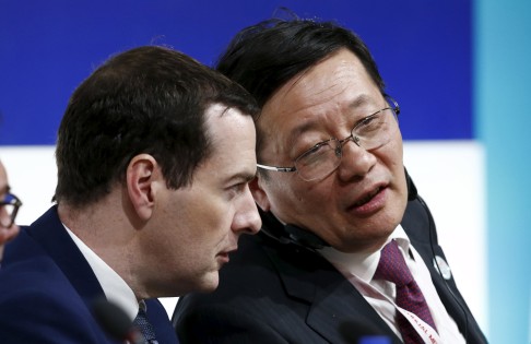 Britain's Chancellor of the Exchequer George Osborne, seen here talking with China's Finance Minister Lou Jiwei at the IMF/World Bank meetings in Lima, has made a big deal of the fact that London and Beijing will "stick together". Photo: Reuters