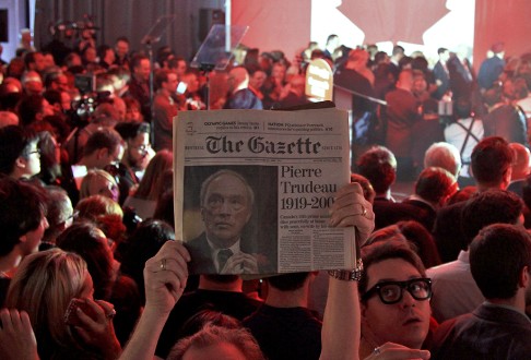 A supporter holds up an old issue of The Gazette newspaper featuring former prime minister Pierre Trudeau, father of Canada's new prime minister, Justin Trudeau. Photo: Reuters