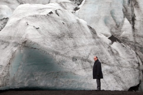 French President Francois Hollande walks on the Solheimajokull glacier in Iceland, where the ice has receded by over 1 kilometre. Hollande is in Iceland to witness the effects of global warming, ahead of climate change talks in Paris. Photo: EPA