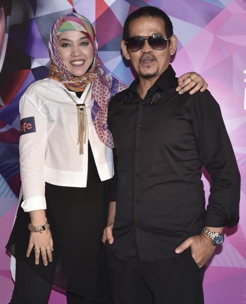 Shila with her musician father, who encouraged her to pursue music.