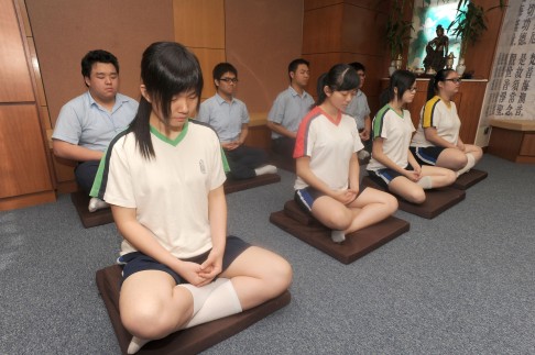 Students at HHCKLA Buddhist Ching Kok Secondary School in a meditation class, as part of their mindfulness training.