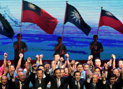Taiwan's ruling Nationalist Kuomintang Party chairman and presidential candidate Eric Chu (fourth from left), President Ma Ying-jeou (third from right) and party officials raise hands at a party congress in Taipei. Photo: Reuters