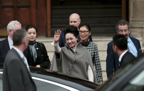 Peng waves to onlookers as she makes her way to engagements in the British capital. Photo: Reuters