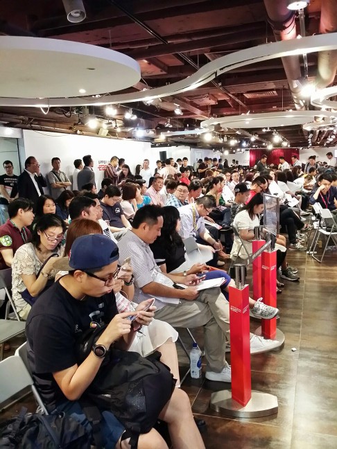 Hundreds of potential home buyers wait at the sales office of Upper East project. Photo: SCMP