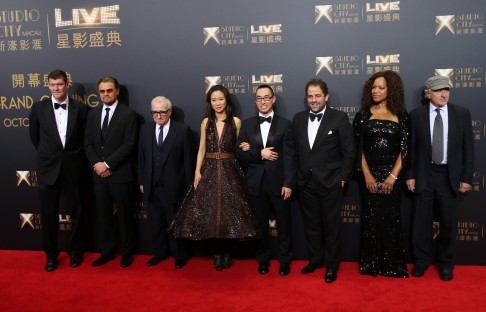 R-L: Robert De Niro, his wife Grace Hightower, producer Brett Ratner, Melco Crown Entertainment's Co-chairman and chief executive officer Lawrence Ho, his wife Sharen Lo, director Martin Scorsese, film star Leonardo DiCaprio and Melco Crown Entertainment's Co-chairman James Packer pose at the red carpet of the opening ceremony for the Studio City project in Macau. Photo: AP