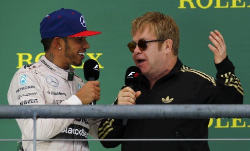 Singer Elton John interviews Briton Lewis Hamilton on the podium in Austin, Texas. Photo: Reuters 