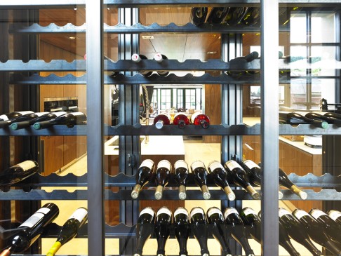 The custom-made wine cellar creates visual interest within the kitchen and maximises the natural light. It has the capacity to hold 400 bottles.