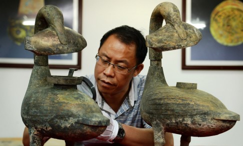 Bronze lamps shaped like ducks.