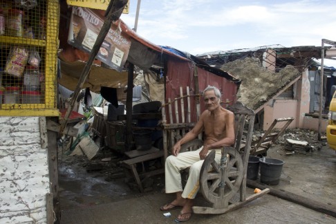 Francisco, 75, outside his home in the Anibong slum of Tacloban. Photo: Reuters