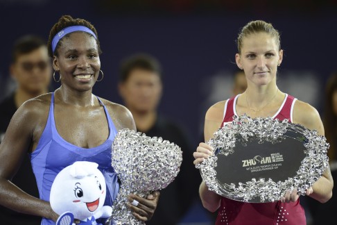 Venus Williams and Karolina Pliskova with their trophies after the final of the WTA Elite Trophy tournament.