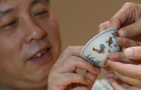 Liu Yiqian and his Ming Dynasty (1368-1644) Meiyintang 'Chicken Cup' last year. Photo: SCMP Pictures