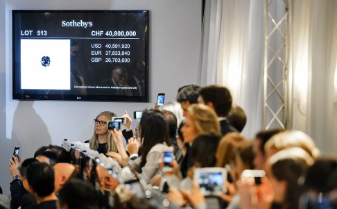 A vivid 12.03-carat diamond dubbed Blue Moon was sold in Geneva for a record 43.2 million Swiss francs ($43 million, 40 million euros). Photo: AFP