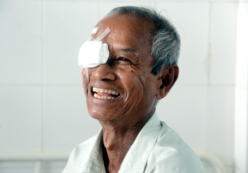 An eye patient in Myanmar grins after undergoing surgery. Eighty per cent of blindness in developing countries is curable. Photo: Xinhua 