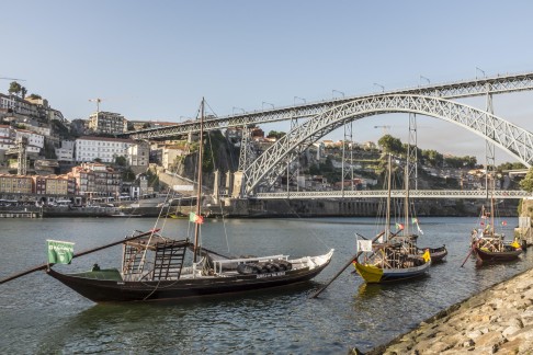 Rabelo boats near the Dom Luis I Bridge, which spans the Rio Douro between the cities of Porto and Vila Nova de Gaia.
