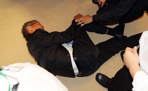 During the commotion, council member Professor Lo Chung-mau fell to the ground. Photo: SCMP Pictures
