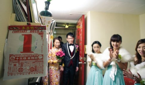 A couple arrives at the groom's home as part of their wedding day rituals.