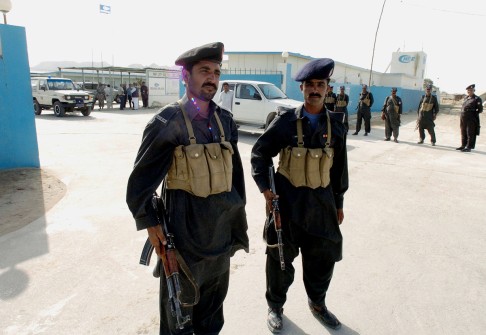 Paramilitary rangers stand guard outside a Chinese company in Gwadar. 