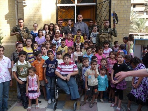 Andrew White in Baghdad with churchgoers.