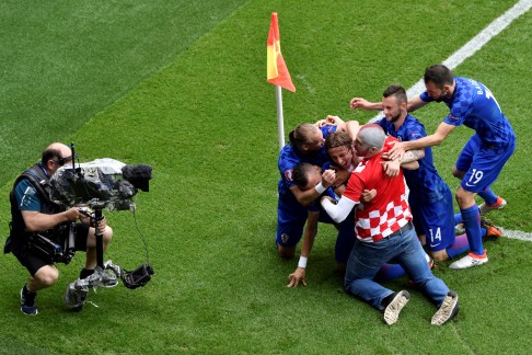 Luka Modric celebrates his goal. Photo: AFP