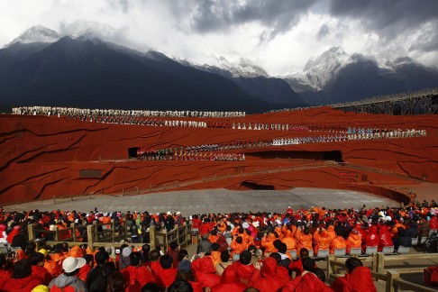Local performers from the Naxi, Yi and Bai ethnic minorities perform the cultural production 'Impression Lijiang' beneath the 5596-metre peak of Jade Dragon Snow Mountain in Lijiang.  Photo: EPA
