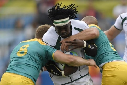 Tim Agaba of South Africa is tackled by Australia’s Pat McCutcheon (left) and James Stannard at the Deodoro Stadium in Rio on Wednesday. Photo: AFP